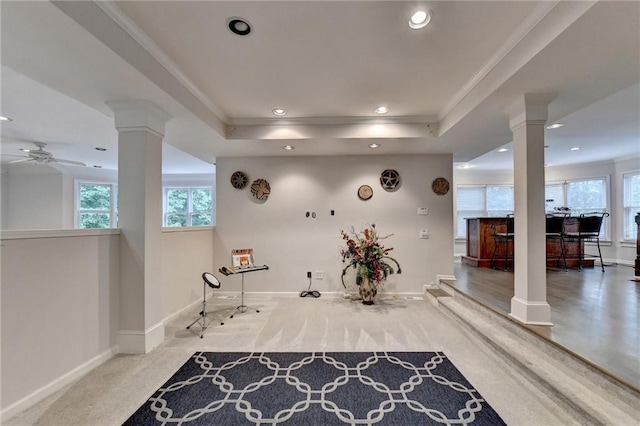 interior space featuring ornamental molding, recessed lighting, baseboards, and ornate columns