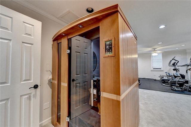 hall with carpet floors, baseboards, ornamental molding, and recessed lighting