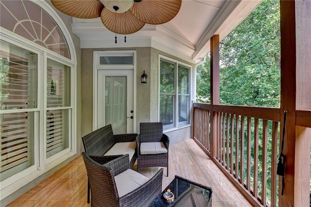 wooden deck featuring ceiling fan