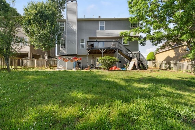 5077 Newpark Dr NW, Acworth, GA 30101 - back of house featuring a yard, stairway, a wooden deck, a fenced backyard, and a storage unit