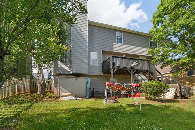 5077 Newpark Dr NW, Acworth, GA 30101 - rear view of house featuring stairway, a lawn, fence, and a deck