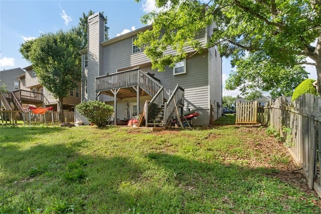 5077 Newpark Dr NW, Acworth, GA 30101 - rear view of house with stairway, a wooden deck, a fenced backyard, and a yard