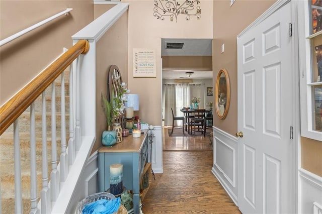5077 Newpark Dr NW, Acworth, GA 30101 - entrance foyer with visible vents, wood finished floors, a towering ceiling, and stairs