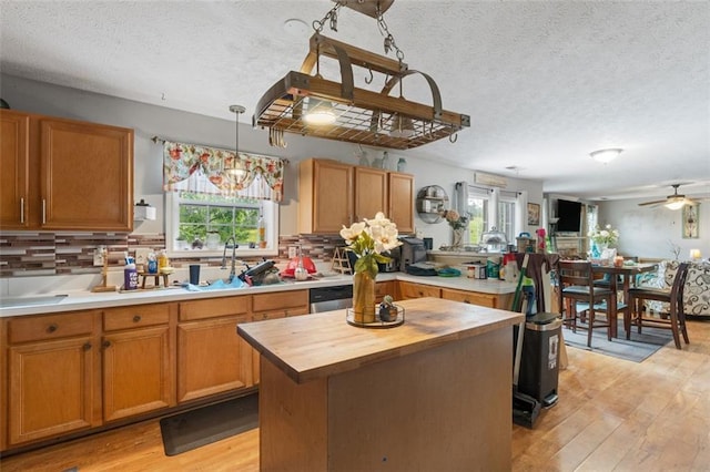 5077 Newpark Dr NW, Acworth, GA 30101 - kitchen with butcher block counters, a textured ceiling, and a healthy amount of sunlight