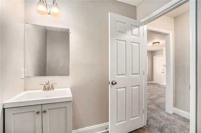 bathroom featuring vanity and an inviting chandelier