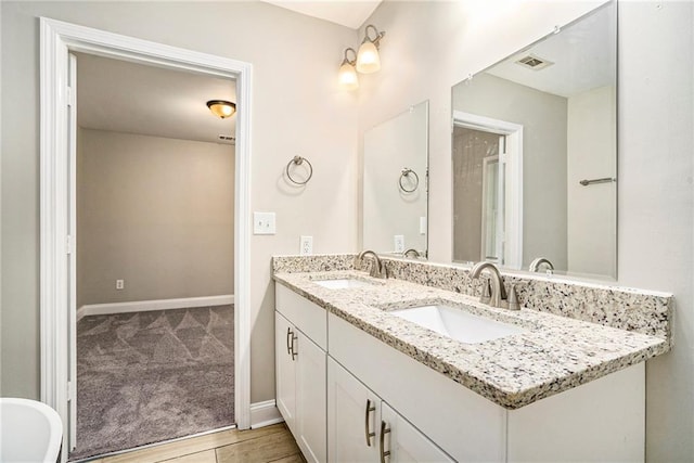 bathroom featuring hardwood / wood-style floors and vanity