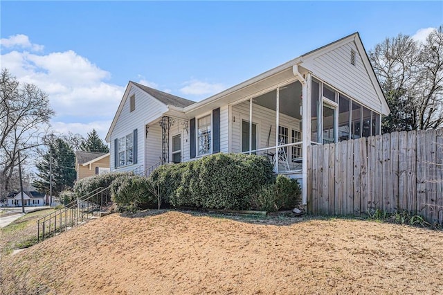 view of property exterior with fence