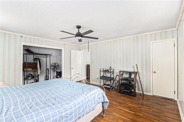 miscellaneous room featuring a ceiling fan, heating unit, tile patterned floors, wood walls, and washer / clothes dryer
