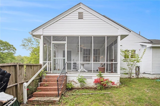 exterior space with fence, a carport, and driveway