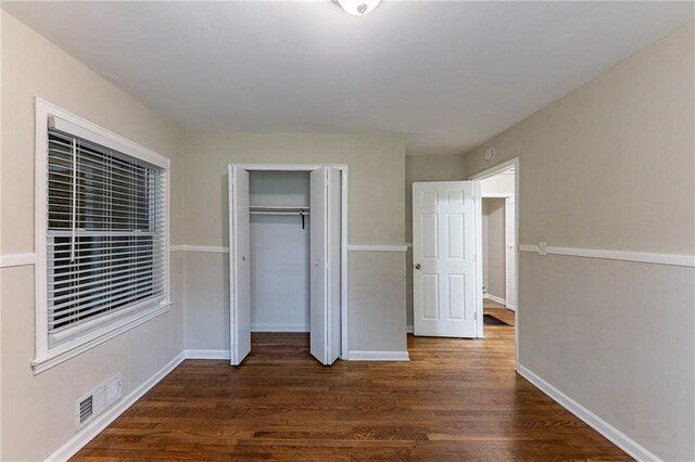 3147 Canary Ct, Decatur, GA 30032 - unfurnished bedroom featuring dark hardwood / wood-style flooring and a closet