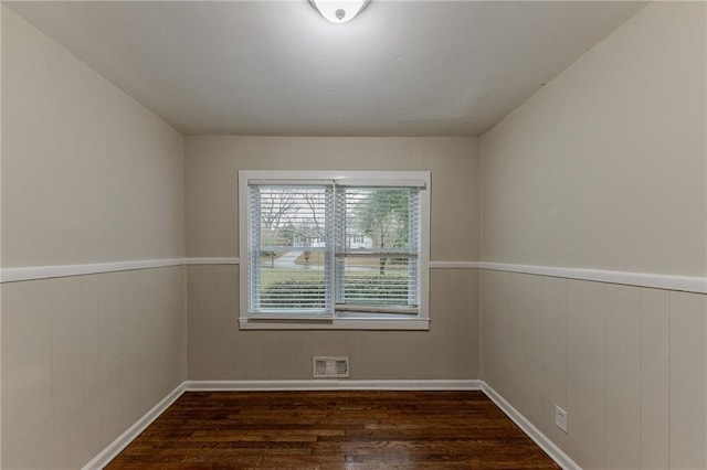 3147 Canary Ct, Decatur, GA 30032 - spare room with wood walls and dark hardwood / wood-style floors