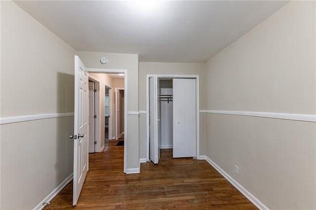 3147 Canary Ct, Decatur, GA 30032 - unfurnished bedroom featuring a closet and dark wood-type flooring