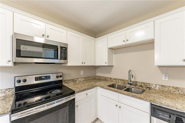 3147 Canary Ct, Decatur, GA 30032 - kitchen featuring sink, white cabinets, light stone counters, and appliances with stainless steel finishes