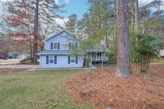 view of front of house featuring a front lawn and a porch