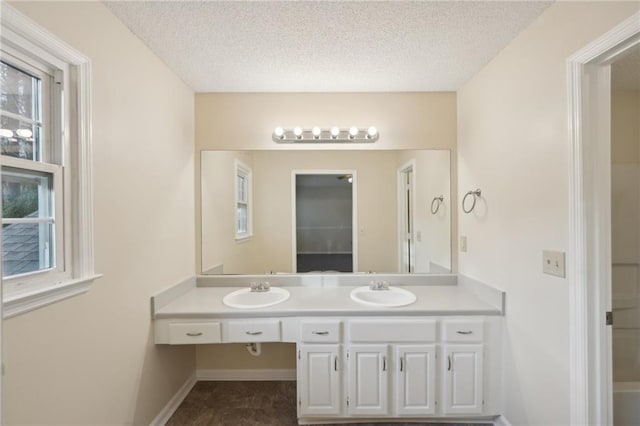 bathroom featuring vanity and a textured ceiling