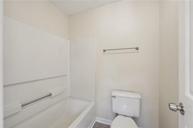 bathroom featuring toilet and a textured ceiling