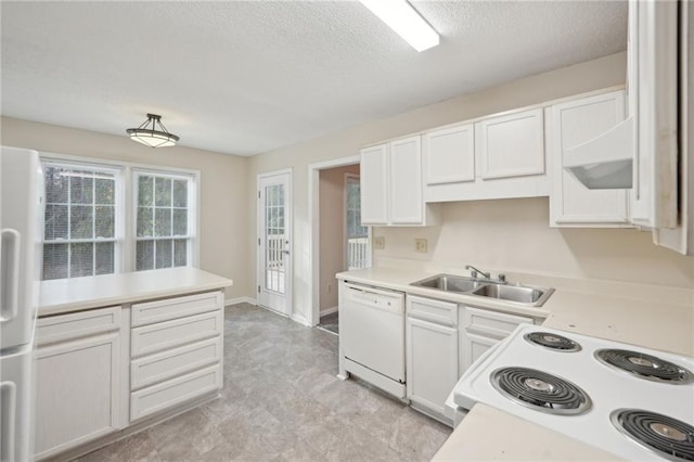 kitchen featuring a textured ceiling, white cabinetry, sink, and white appliances