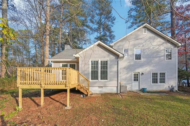 back of house with a lawn, central AC unit, and a deck