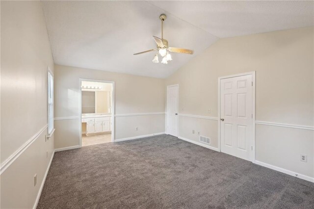 spare room featuring carpet, ceiling fan, and lofted ceiling