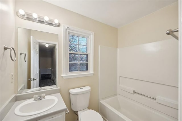 full bathroom with vanity, bathing tub / shower combination, and toilet