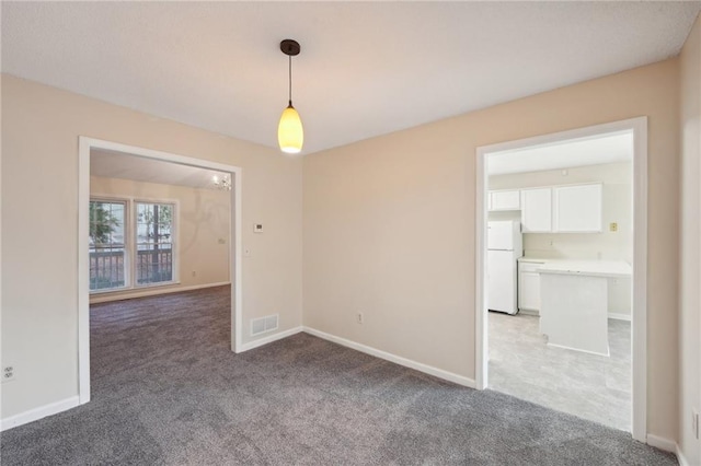 empty room featuring carpet floors