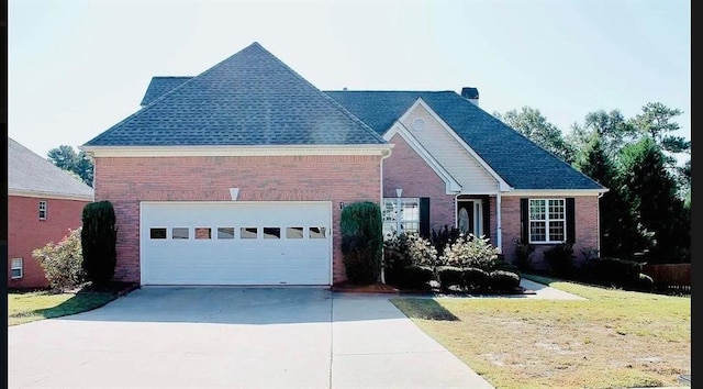 1225 Martin Chapel Ln, Lawrenceville, GA 30045 - view of front of property with brick siding, concrete driveway, a front yard, and an attached garage