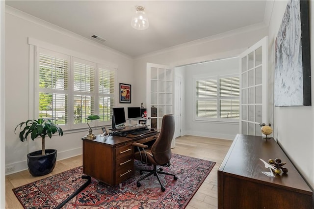 office space featuring light wood-type flooring, french doors, and ornamental molding