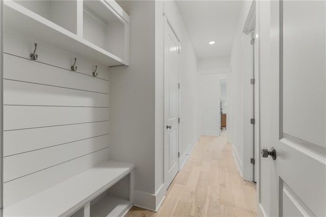 mudroom with light hardwood / wood-style flooring