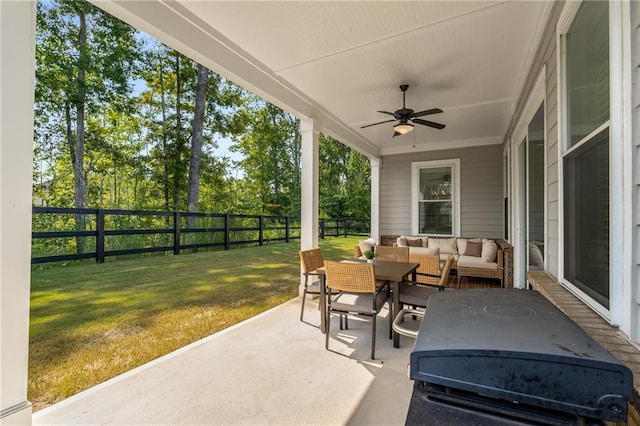 view of patio with an outdoor living space and ceiling fan