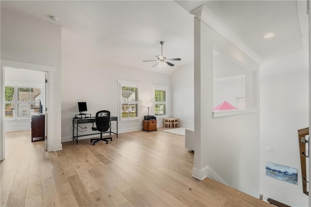 office area featuring lofted ceiling, light hardwood / wood-style flooring, and ceiling fan