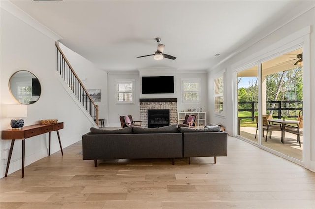 living room featuring light hardwood / wood-style floors and a healthy amount of sunlight