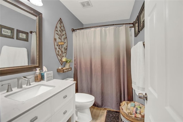 1784 Virginia Grove Ln, Lawrenceville, GA 30045 - bathroom featuring vanity, wood finished floors, and a shower with shower curtain