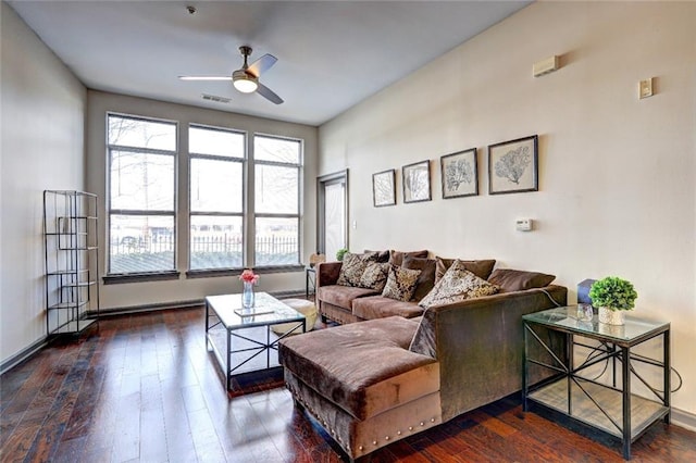 living room with a wealth of natural light, hardwood / wood-style floors, and ceiling fan