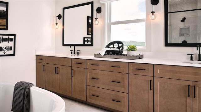 bathroom featuring vanity and a tub