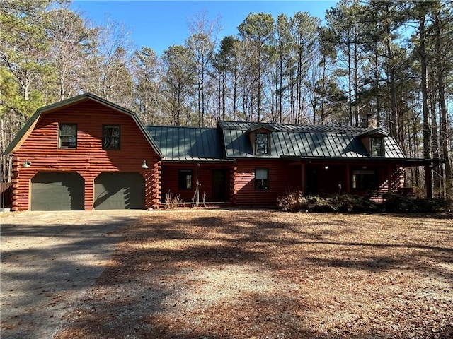 log home featuring a garage