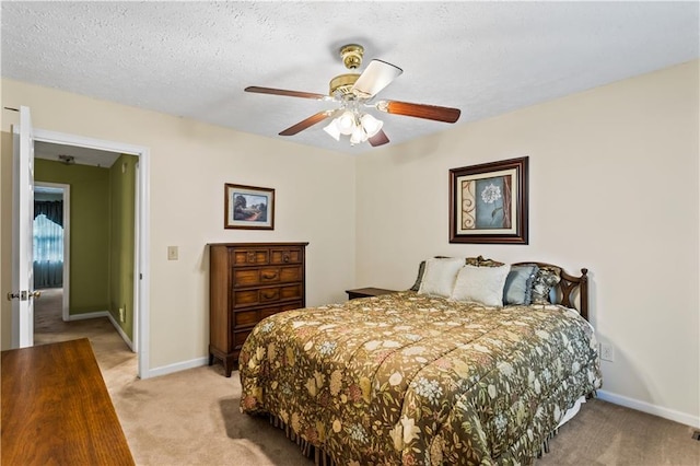 bedroom featuring light carpet, baseboards, and a ceiling fan