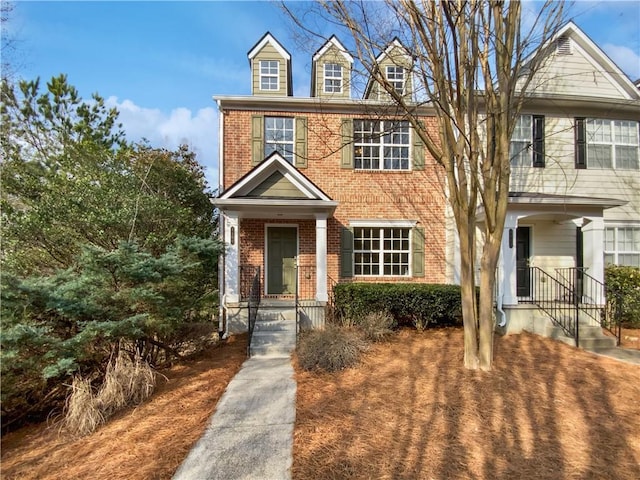 view of front facade featuring brick siding