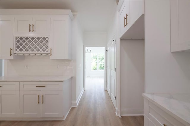 hall with light hardwood / wood-style flooring