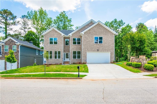 view of front of home with a garage and a front lawn