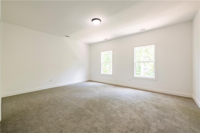 unfurnished room with carpet flooring