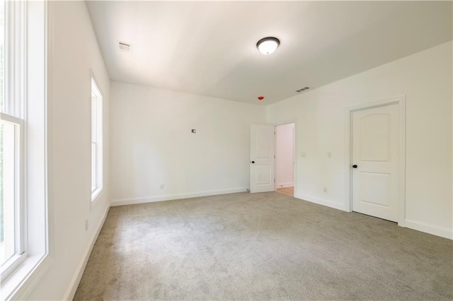 unfurnished room featuring carpet