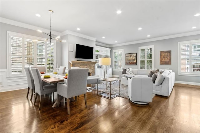 2362 Saint Davids Sq NW, Kennesaw, GA 30152 - dining room featuring ornamental molding, wood finished floors, a chandelier, recessed lighting, and wainscoting