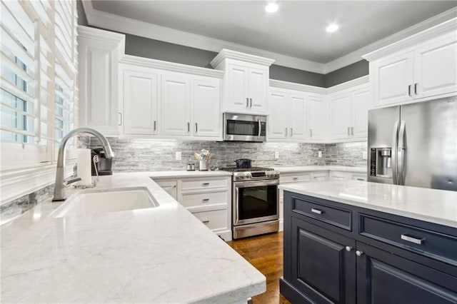 2362 Saint Davids Sq NW, Kennesaw, GA 30152 - kitchen featuring stainless steel appliances, a sink, white cabinetry, dark cabinets, and decorative backsplash