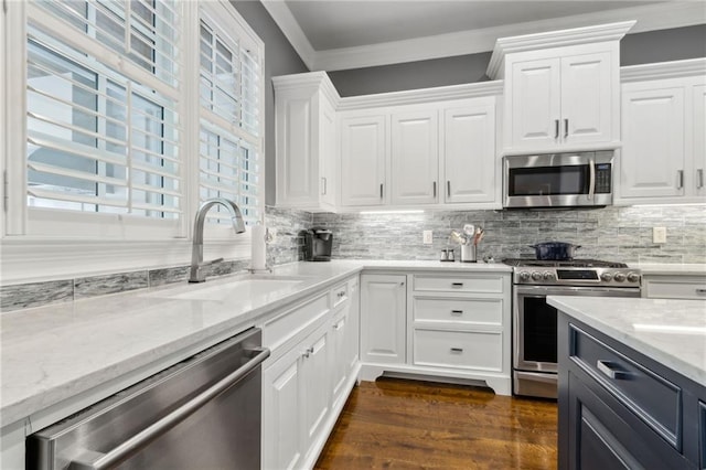 2362 Saint Davids Sq NW, Kennesaw, GA 30152 - kitchen with stainless steel appliances, a sink, white cabinets, crown molding, and light stone countertops