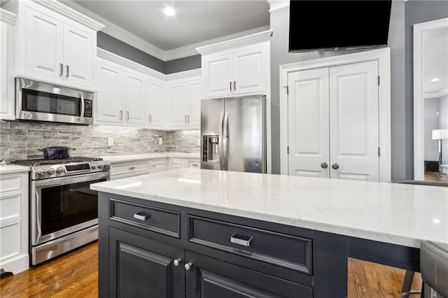 2362 Saint Davids Sq NW, Kennesaw, GA 30152 - kitchen featuring stainless steel appliances, white cabinetry, backsplash, ornamental molding, and recessed lighting