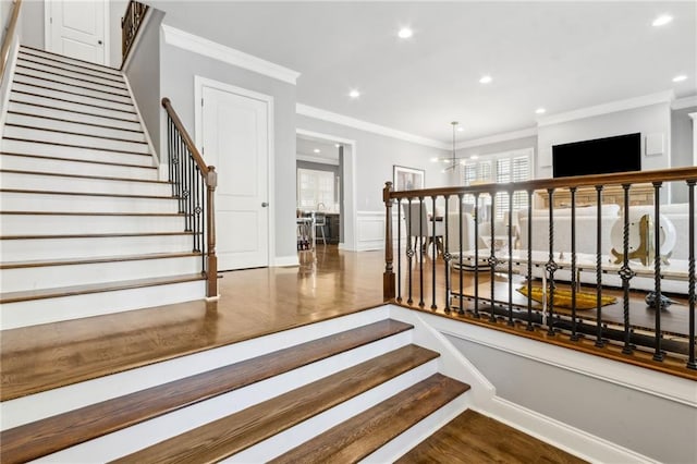 2362 Saint Davids Sq NW, Kennesaw, GA 30152 - stairway with crown molding, healthy amount of natural light, recessed lighting, a chandelier, and wood finished floors