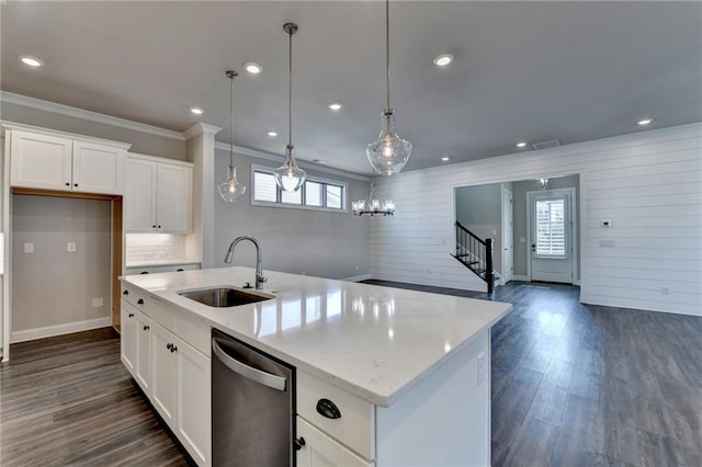 kitchen with plenty of natural light, dark wood-style flooring, dishwasher, and a sink