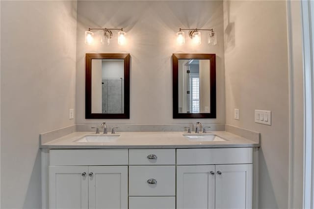 bathroom with a sink and double vanity