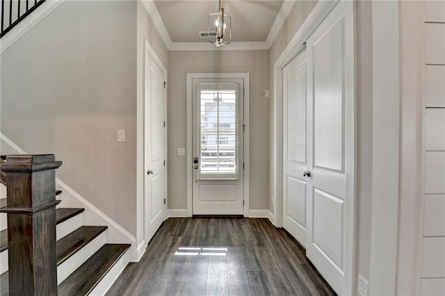 foyer entrance with baseboards, stairs, visible vents, and dark wood finished floors