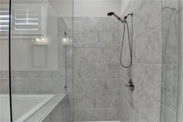 full bath featuring tiled shower